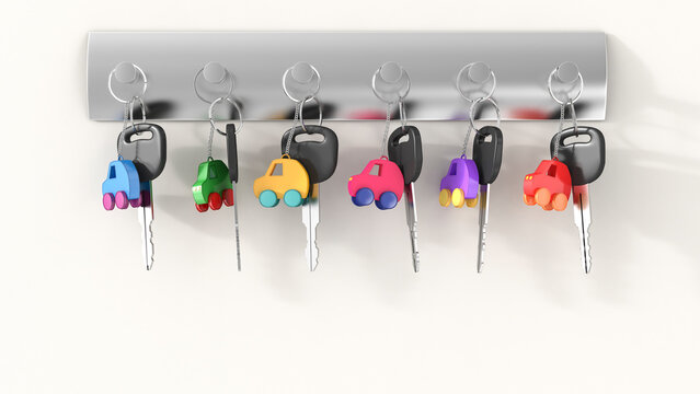 Car keys with different key ring hanging on key hook, electro car