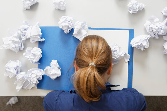 Germany, Businesswoman with file on table