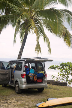 Indonesia, Java, car and surfboard at the coast