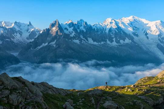 France, Mont Blanc, Lake Cheserys, hiker in front of Mount Blanc at sunrise