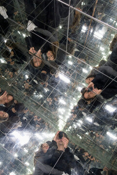 Couple taking selfies in a house of mirrors