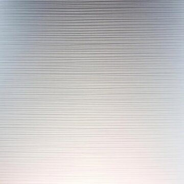 Textured brushed aluminum with fine parallel lines, exuding a cool, contemporary aesthetic,  detail,  industrial