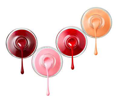 Four bottles of dripping nail polish in front of white background