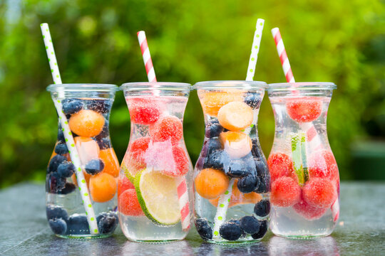 Carafes of miscellaneous fruit infused water