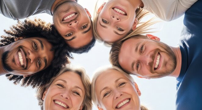 Smiling diverse group of people in circle looking at camera