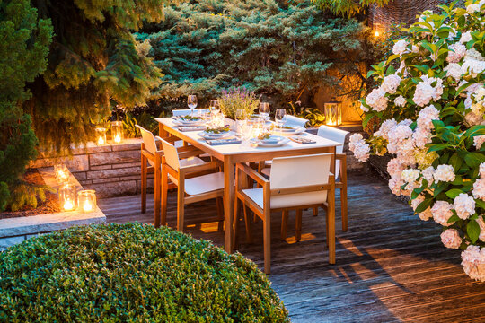 Laid table on lighted terrace