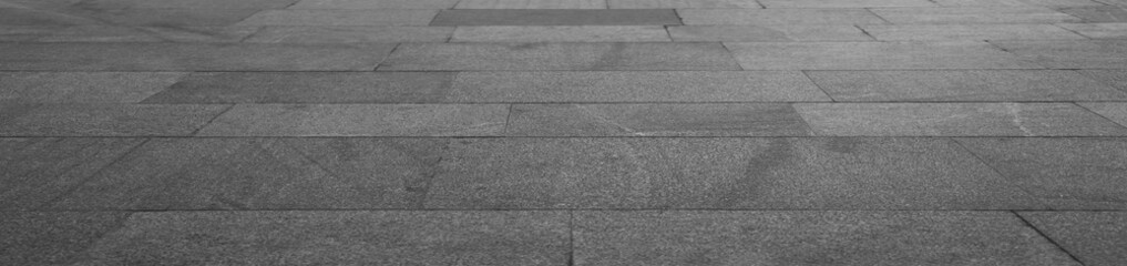 Fototapeta premium empty stone floor top in perspective. grey tile floor background in perspective view. line. empty copy space stone street. pavement. Granite outdoor tiled floor. gray granite. Marble texture
