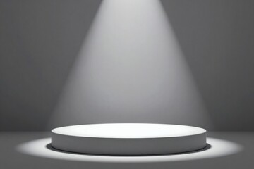 Obraz premium Elegant spotlight shining on a round white platform in a gray studio