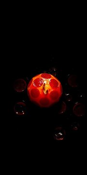Glistening pepperoni jewels nestled in umbral depths, a celestial body in a culinary cosmos, rendered in stark light and shadow,  studio, pepperoni
