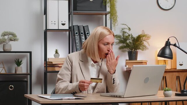 Caucasian mad stressed mature freelancer try to pay online shopping with laptop blocked credit card. Annoyed businesswoman girl buying, bank refuse problem unsuccessful payment lack of money balance.