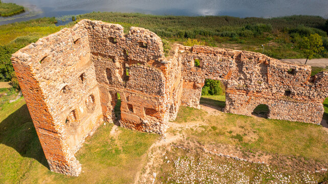 Aerial photo from drone of the city of Ludza. In the background, the Ludza Medieval Castle, the city's churches, and lakes are visible on a sunny summer day. Ludza, Latgale, Latvia. 