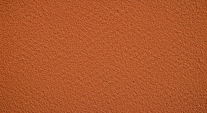 Texture of red clay tennis court surface close up