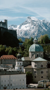 Salzburg historic old town against snowcapped Untersberg mountain in springtime, Salzburg Land, Austria