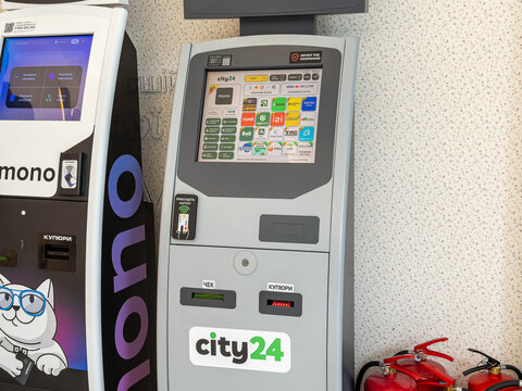 Kyiv, Ukraine - March 20, 2026: A City24 payment terminal shows various banking services, highlighting automated financial technology for convenient self-service money transactions