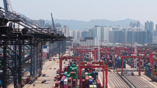 Large Container Terminal With Colorful Shipping Containers and Cranes Operating in a Hong Kong Logistics Hub, Symbolizing International Trade and Global Supply Chains. Container Terminal Handling