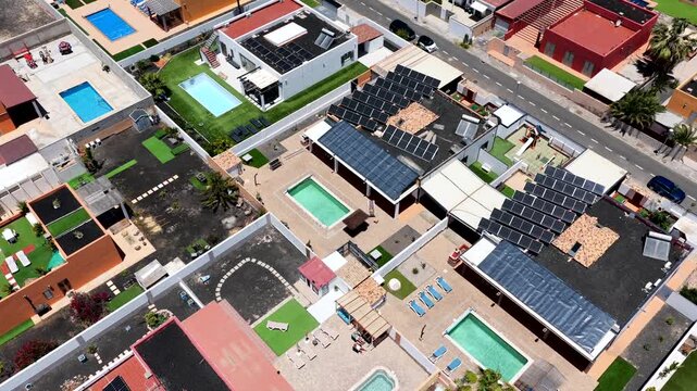 Aerial view of luxury expatriate villas with private swimming pools and real estate development in Caleta de Fuste