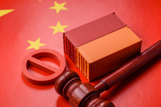 The cargo container ban on the China flag as a conceptual backdrop. The cargo container embargo