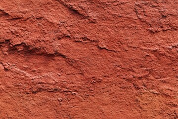 Fototapeta premium Rough Red Rock Wall Texture Close Up Cracked Weathered Surface Natural Stone Background Geological Pattern Material Design