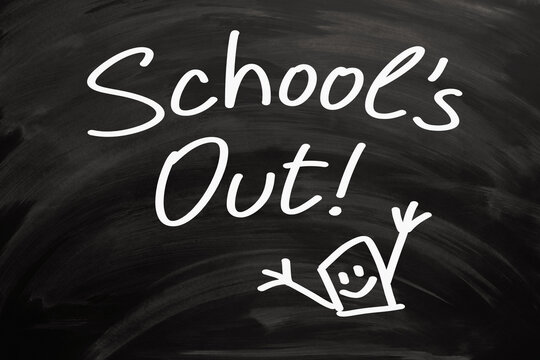 Phrase School Is Out Handwritten On Blackboard