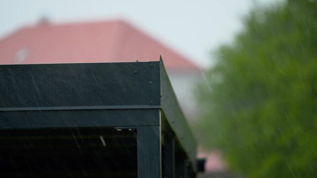 heavy rain fall on the gutter roof slow motion