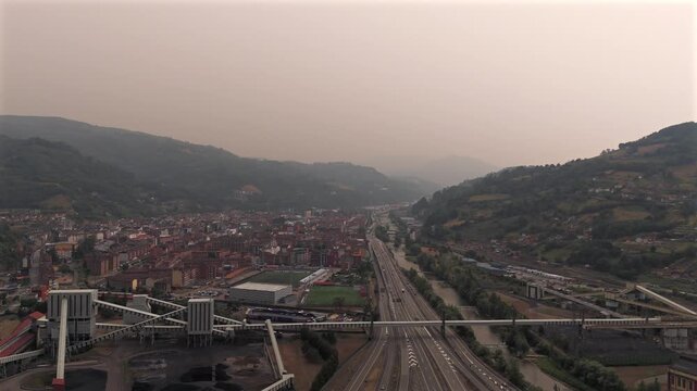 Drone aerial view of mining landscape and mountain houses near La Pena Asturias