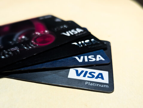 VISA Platinum credit cards on a neutral surface for cashless payment concept