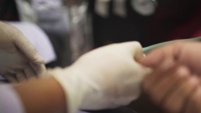 Close-Up of Blood Pressure Check on Patient Hand