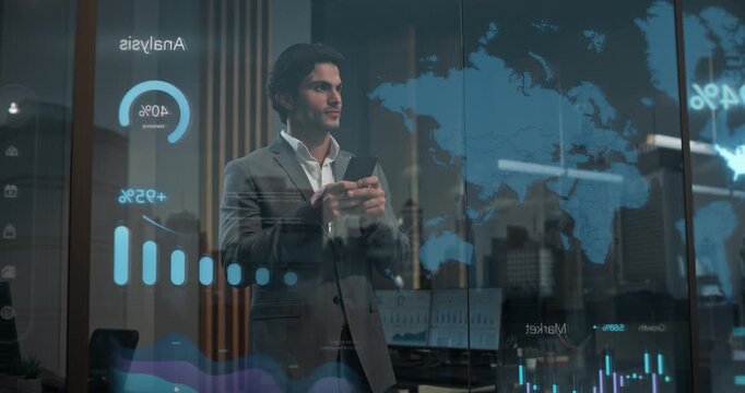 Businessman Inside Modern Office Using Smartphone Near Reflective Window Displaying Holographic World Map, Global Analytics Overlays and Ai-driven Market Intelligence Visualization for Strategy.