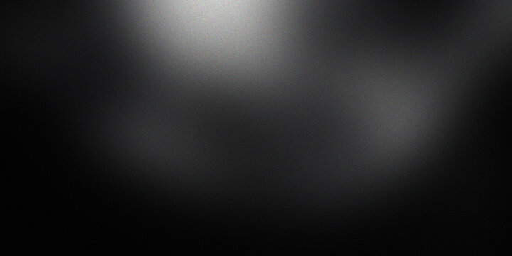 Dark moody black background with grainy texture and central spotlight glow creating mysterious dramatic atmosphere for design.