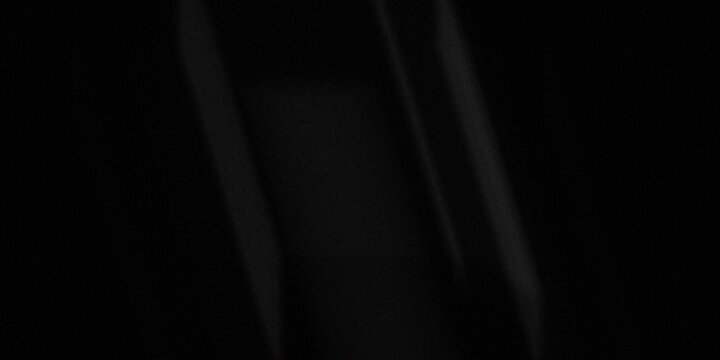 Deep black background with subtle vertical gray lines and soft light accents.