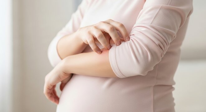 A pregnant woman scratching her arm due to pregnancy pruritus.