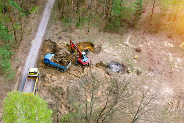 Naklejka premium Forest land being prepared for development by machines