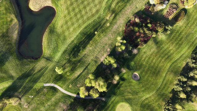 Nature rich golf course with trees and calm water