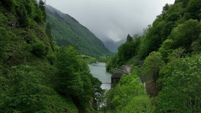 Austria cinematic aerial view of Sigmund Thun Klamm waterfall and alpine gorge surrounded by forest near Kaprun. Scenic drone footage of Austrian mountain nature and dramatic canyon landscape in 4K.