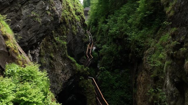 Austria breathtaking drone flythrough inside Sigmund Thun Klamm waterfall canyon near Kaprun. Cinematic aerial footage of alpine gorge, waterfalls and dramatic rocky landscape in ultra HD 4K.