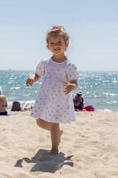 Little girl  dancing on the beach