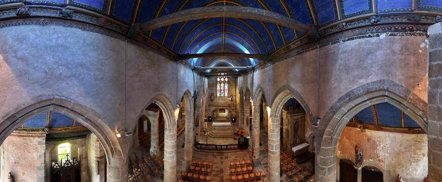 Aerial view of the interior of Eglise Saint-Melaine de Morlaix featuring the blue vaulted ceiling and historic stone arches Morlaix, Bretagne, France.