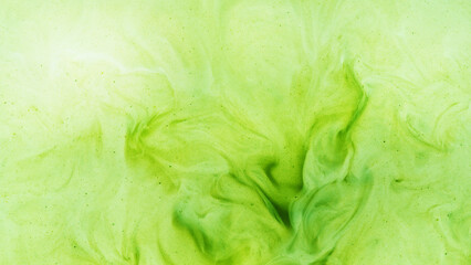 Pour of Milk Into Matcha Latte © Lukas Gojda