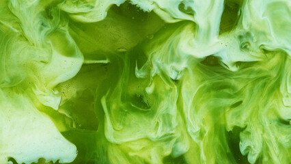 Pour of Milk Into Iced Matcha Latte © Lukas Gojda