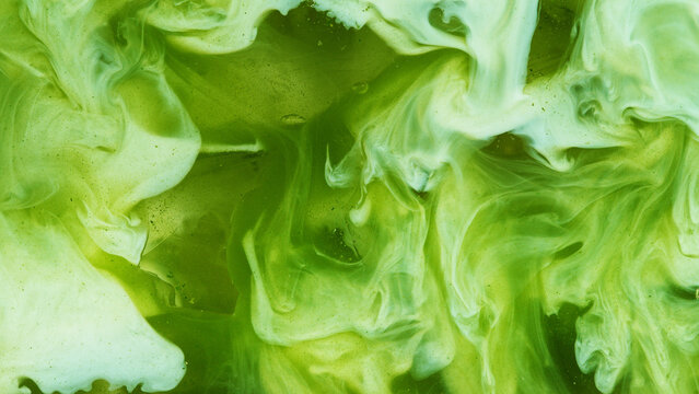 Pour of Milk Into Iced Matcha Latte