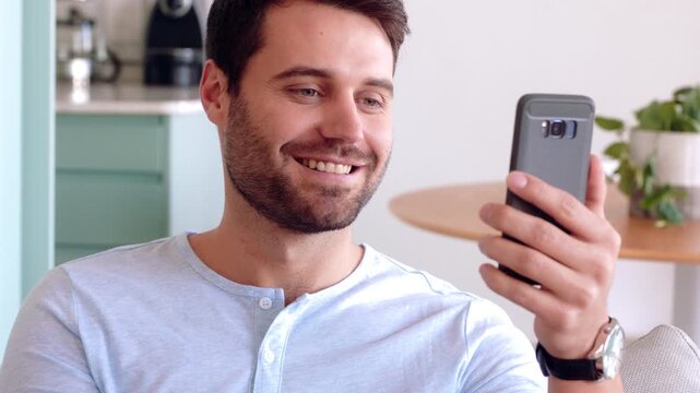 Video call, sign language and man with phone on sofa for communication, contact and connection. Home, cellphone and person with I miss you gesture for online conversation, chat and wave for hello