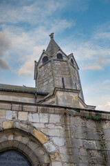 Fototapeta premium The Church of Notre-Dame de Puiseaux is an imposing 13th-century Gothic church, famous for its distinctive spiral spire and historical significance, France