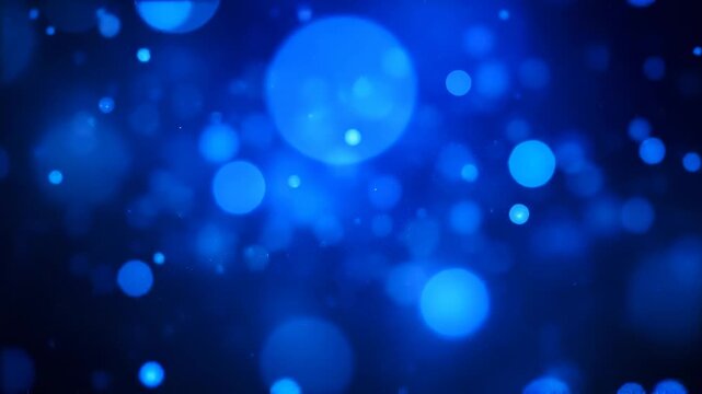 Abstract blue bokeh lights shimmering and dancing in a dark, ethereal space