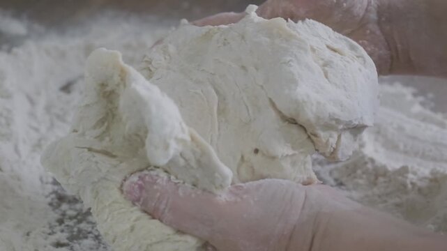 female hands kneading unleavened dough, work dough with love, connecting generations through art bread making, handcrafted food making, satisfying tactile pleasure, Fresh ingredients
