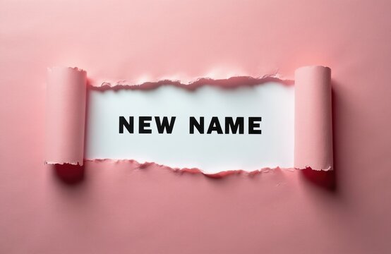 Torn pink paper reveals text NEW NAME on white background. Concept of rebranding identity change or business renaming. Fresh start discovery.
