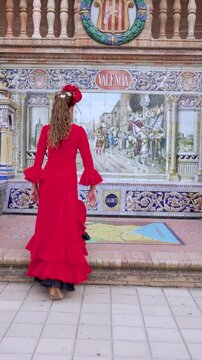 Traditional Spanish girl dancing flamenco in Seville, Spain