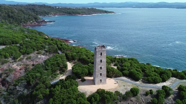 Aerial Orbit Around Boyd Tower Above Rugged Coastline