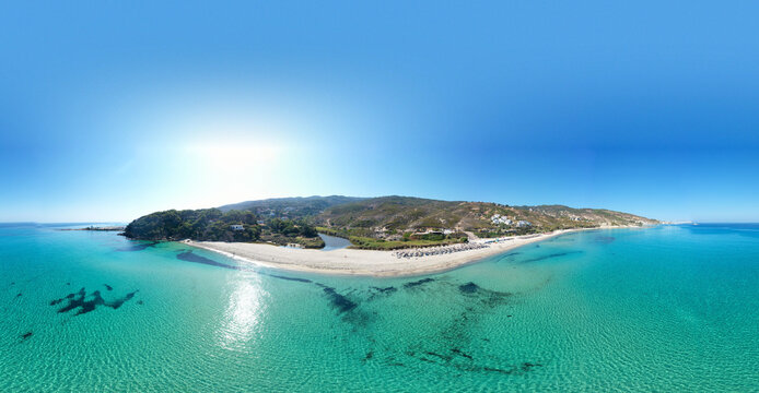 Summer drone panorama of Gialiskari to Armenistis coast over turquoise water in in Ikaria island, Greece