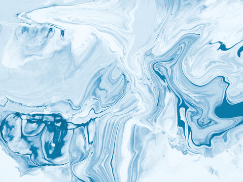 Abstract fluid art background in icy blue and white tones with marble texture and flowing acrylic paint patterns.