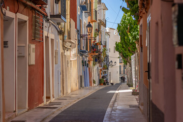 Fototapeta premium The cityscape of Mediterranean town Villajoyosa, Spain, with its narrow, empty streets and ancient authentic architecture